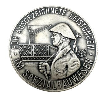 Original Cold War era DDR NVA medal 'Für ausgezeichnete leistengen im spezialbauwesen - Für den Schutz - Der Arbeiter und Bauern macht'