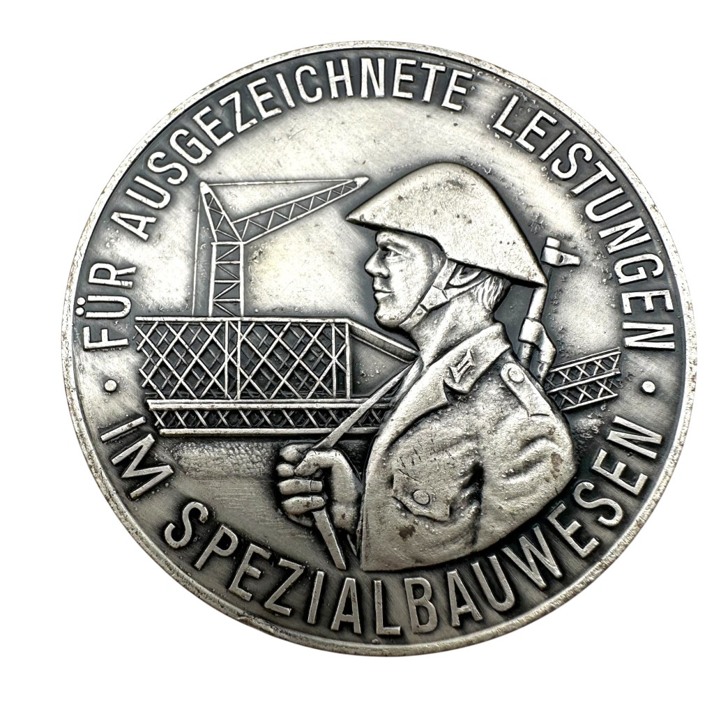 Original Cold War era DDR NVA medal 'Für ausgezeichnete leistengen im spezialbauwesen - Für den Schutz - Der Arbeiter und Bauern macht'