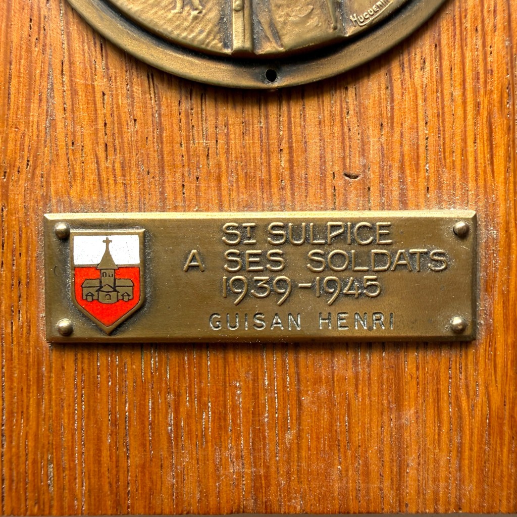 Original Swiss army commemorative plaque mounted on a wooden display board honouring the soldiers of St. Sulpice during the years 1939–1945
