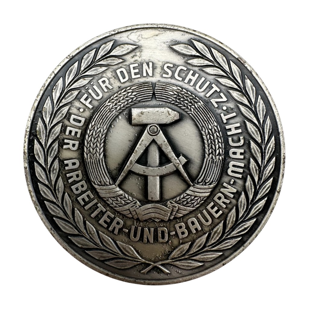 Original Cold War era DDR NVA medal 'Für ausgezeichnete leistengen im spezialbauwesen - Für den Schutz - Der Arbeiter und Bauern macht'