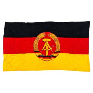 Original East German NVA DDR national flag with state emblem 125 x 75 cm Cold War militaria collectible.