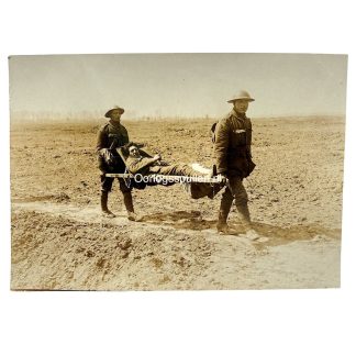 Original WWI German Army photo British POWs wearing Brodie helmets carrying wounded soldier on stretcher between Lens and Arras Western Front.