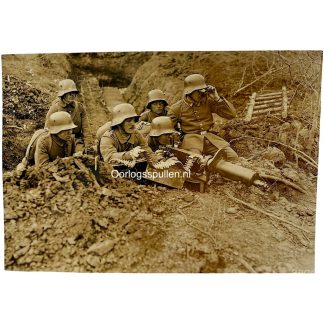 Original WWI German Army photo machine gun position with Stahlhelm soldiers and assault troops in a trench on the French Western Front.