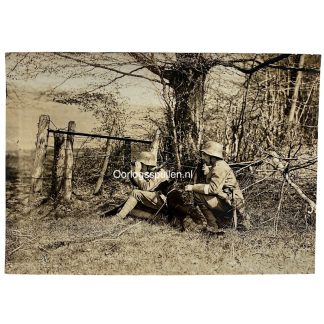 Original WWI German Army Kriegshundeschule photo showing German soldiers on patrol beside barbed wire on the Western Front during World War I.