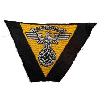Original WWII German NSKK overseas cap insignia with embroidered eagle and swastika for collectors of German Second World War militaria