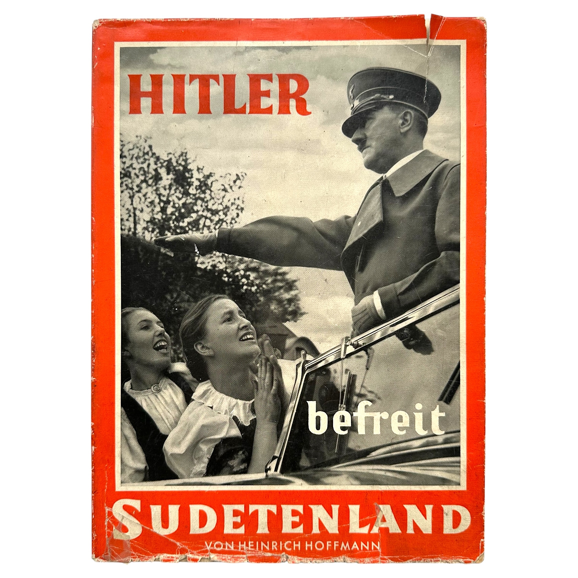 Original 1938 German NSDAP photo book 'Hitler befreit Sudetenland' by Heinrich Hoffmann with original dust jacket and historical Adolf Hitler photographs.