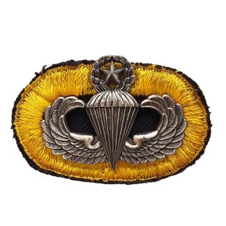 Original 1960s US Army Master Parachutist Badge with yellow black embroidered Airborne background trimming oval for American paratroopers.