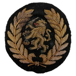 Origineel Nederlands KNIL petembleem 1945-1949 goudkleurig geborduurde Nederlandse leeuw Nederlands-Indië militaire uniforminsigne.