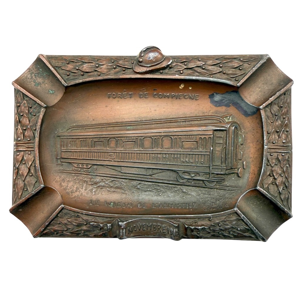 Original WWI French Army Compiègne Armistice ashtray 11 November 1918 with railway carriage and Adrian helmet for militaria collectors.