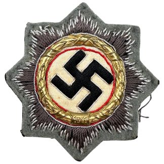 Original WWII German Cloth German Cross in Gold Deutsches Kreuz in Gold 1941 with embroidered starburst and metal laurel wreath.