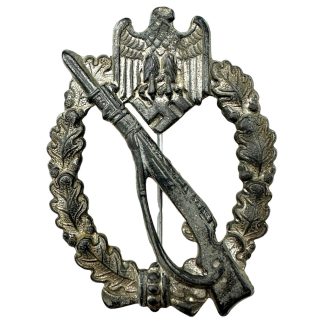 Original WWII German Infantry Assault Badge Infanterie Sturmabzeichen in silver with eagle, rifle, bayonet and oak leaf wreath.
