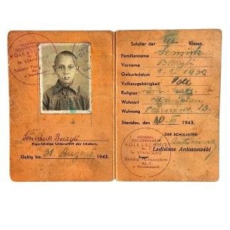 Original WWII German Volksschule Nr. 7 Stanislau provisional Ausweis 1943 with portrait photograph, personal details and school stamps.