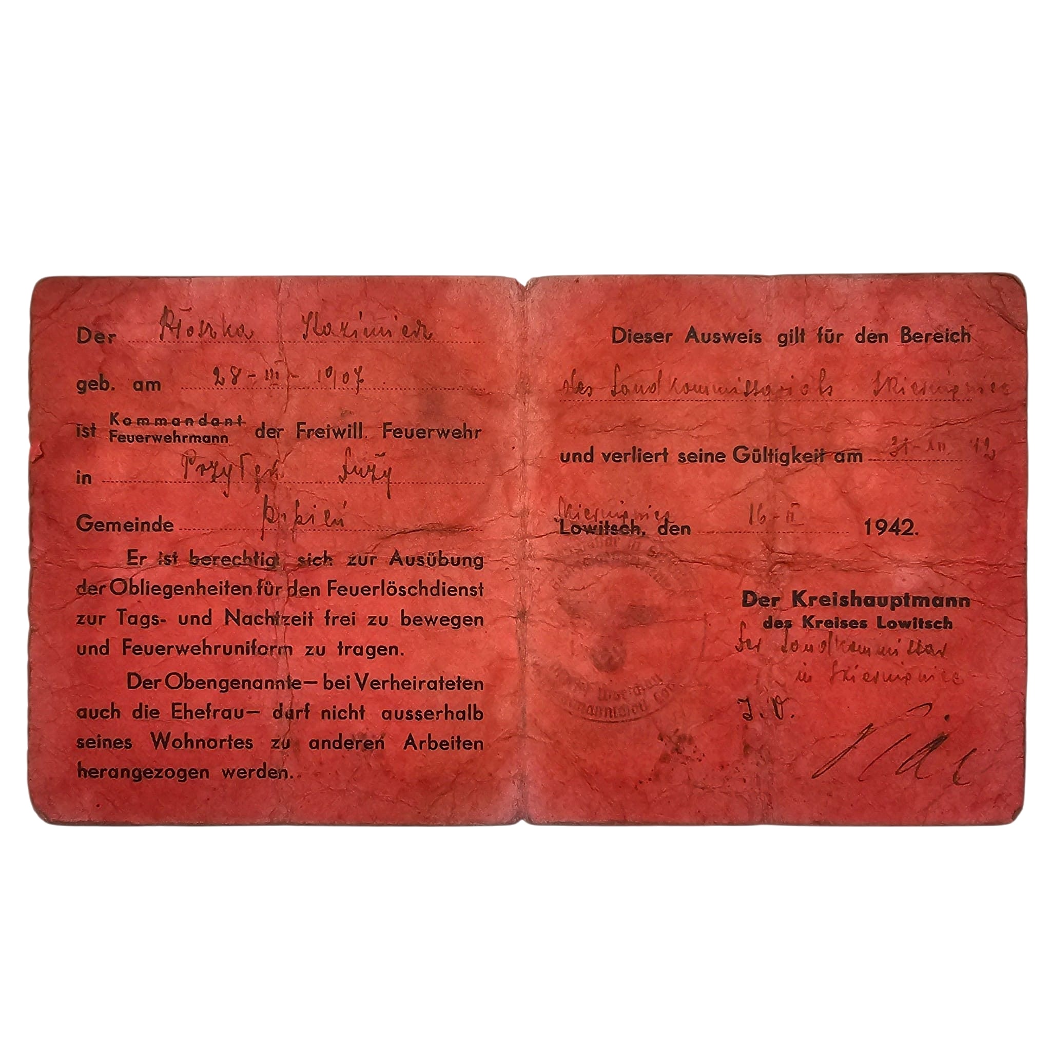 Original WWII German Feuerwehr Ausweis 1942 volunteer fire brigade Lowitsch General Government occupied Poland with stamps and signatures.