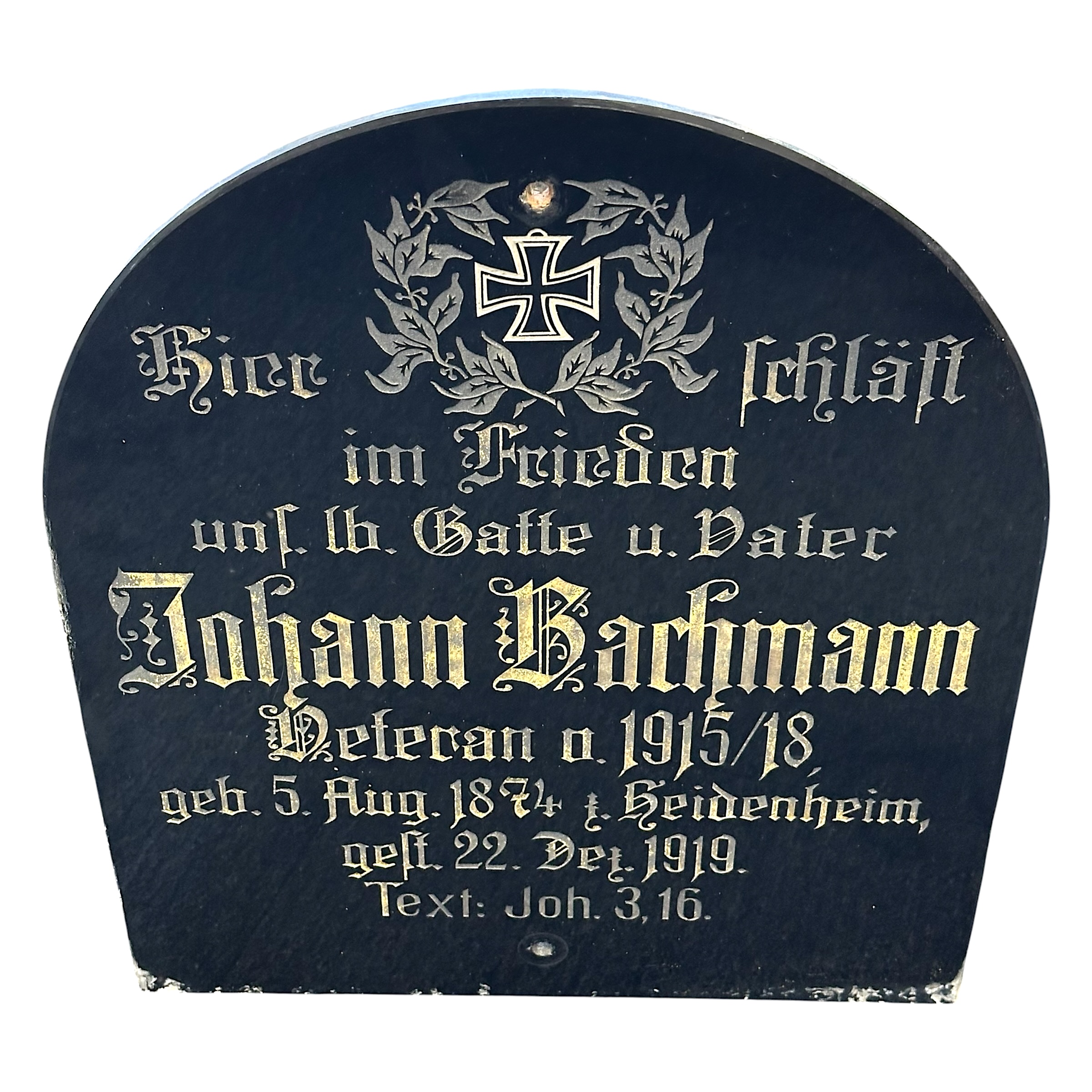 Original WWI German black glass veteran grave plaque Johann Bachmann 1915-1918 with Iron Cross, Heidenheim, 1874-1919, measuring 51 x 42 cm.
